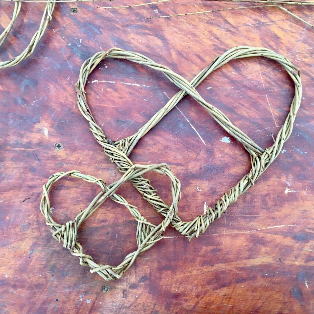 Woven willow hearts created at the Weird Sticks community willow workshops as part of the Crediton Heart Project