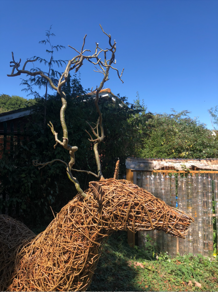 Completed community stag sculpture created by the children of Brixham with Weird Sticks