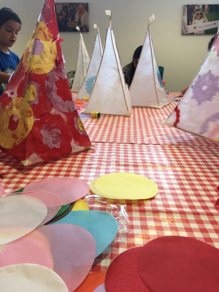 Children decorating their lanterns at the Weird Sticks Exeter Carnival Lantern Workshop at Exeter Library