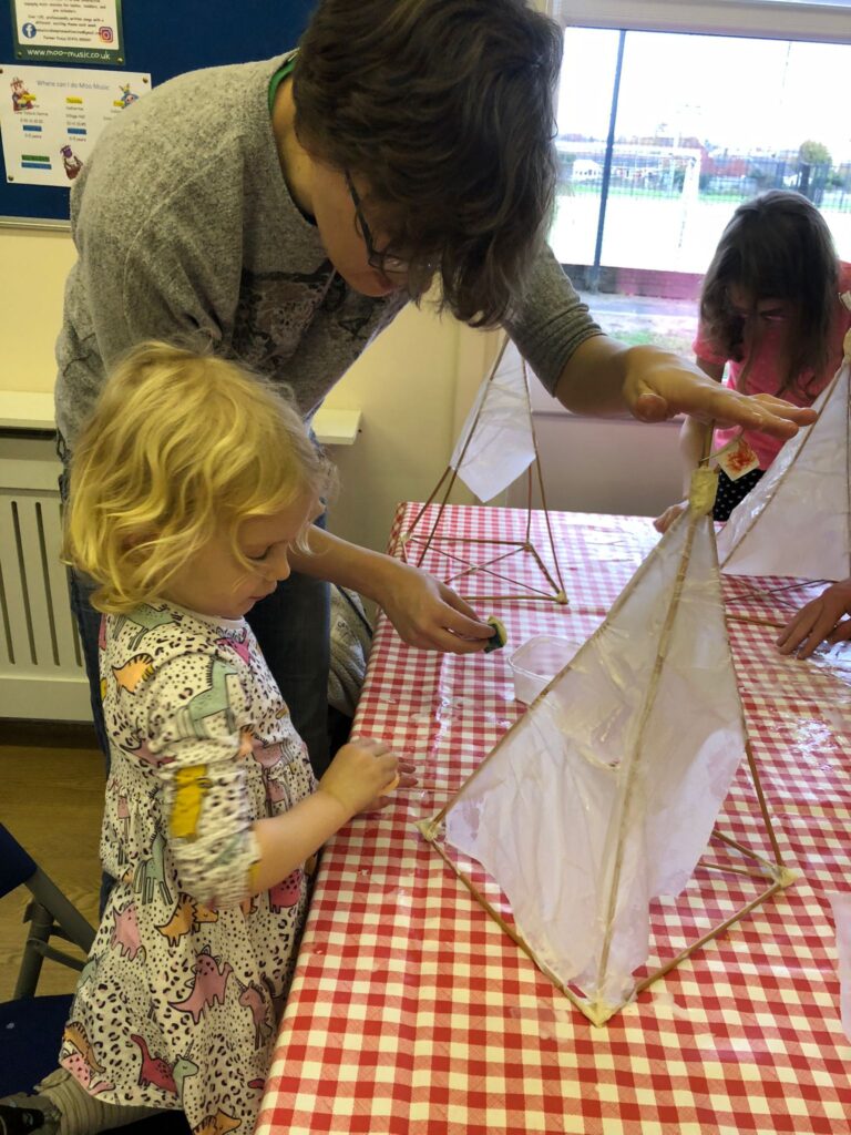 Mother and child making lanterns at the Weird Sticks festive family lantern workshop in Cullompton