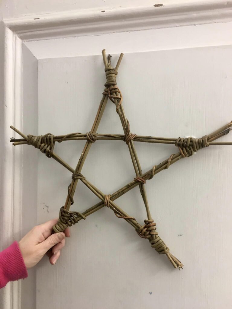 Basic willow star frame displayed at Exeter Quay Christmas Star workshop run by Weird Sticks