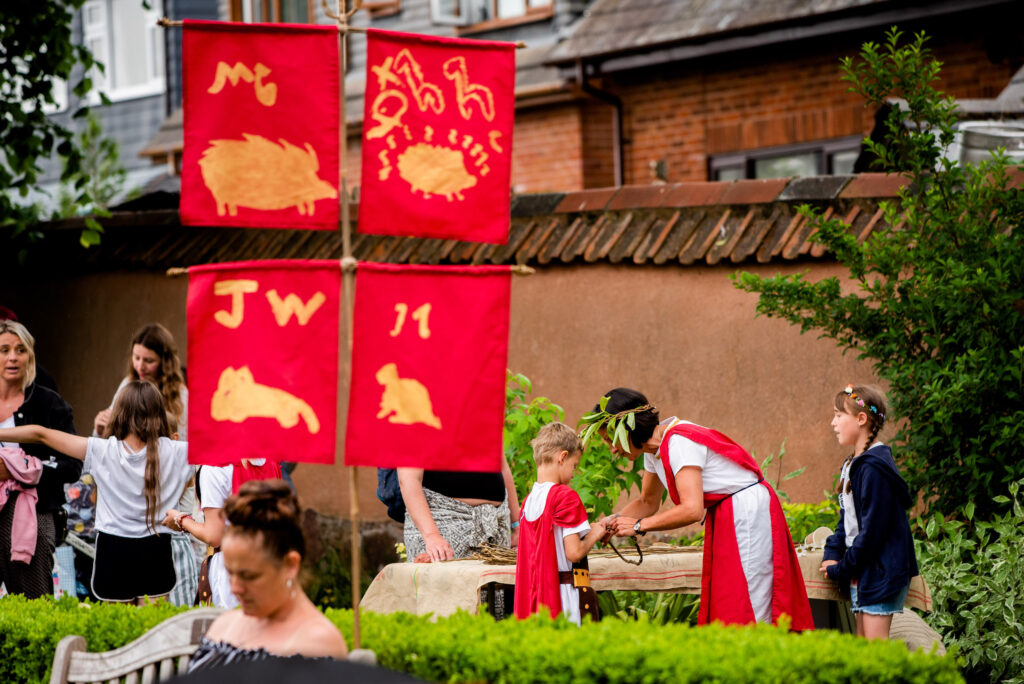 Roman Standard Flags created by Willowbank Primary School pupils with Weird Sticks on display at the Cullompton Roman Festival