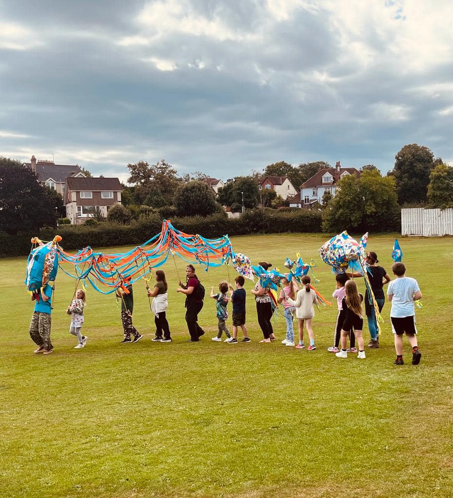 Practice sea creature parade with giant sea serpent and fish parade puppets created with Weird Sticks at Play Torbay