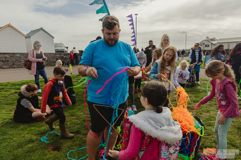 Participants weaving bouncing sea creatures at the weird Sticks workshops during Goodrington Seafest