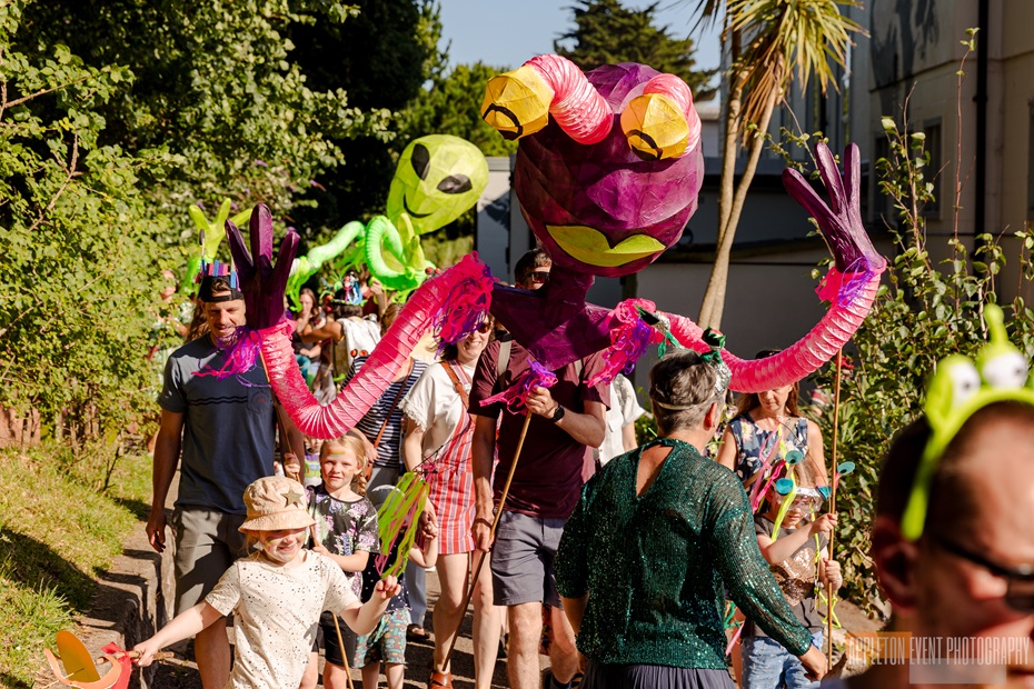 Giant Alien puppets created by Weird Sticks CIC in the Exmouth Festival samba parade 2024