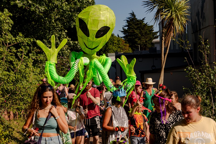 Giant Alien puppets created by Weird Sticks CIC in the Exmouth Festival samba parade 2024