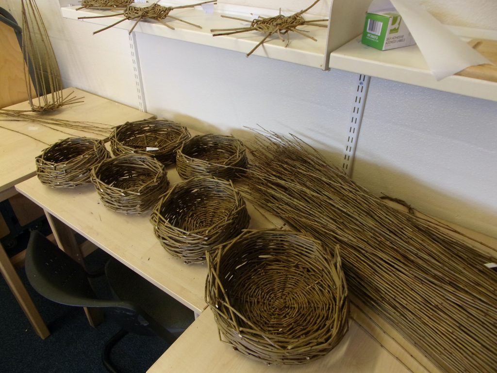 Willow baskets created by participants at HMP Channings Wood during a Weird Sticks workshop as part of the Open Door Project