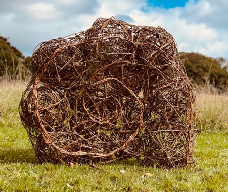 Community created willow Ammonite sculpture with Weird Sticks at A La Ronde