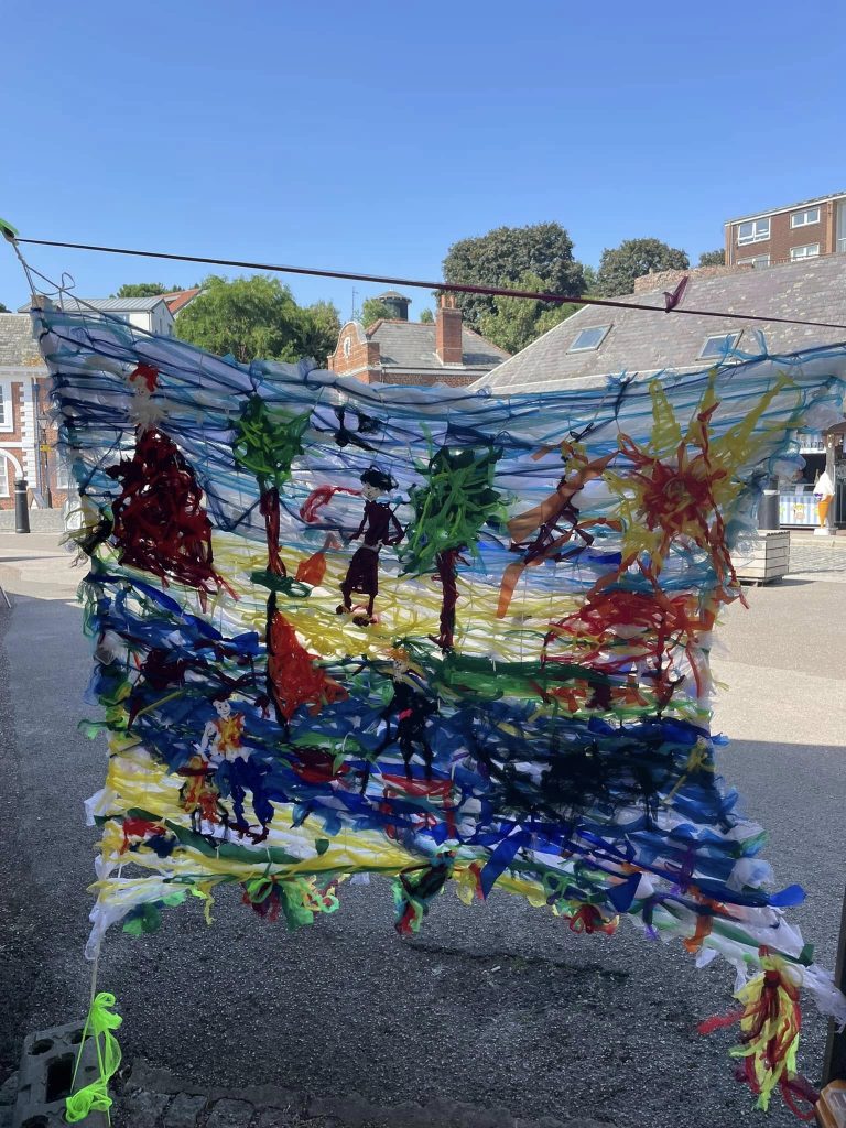Close up image of 'Woven in Time' artwork created by Weird Sticks at Exeter Quay